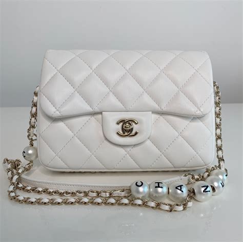 chanel pearl bag white|Chanel bag with pearls strap.